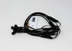 Four pre-owned pair of Beats By Dre BeatsX Wireless Bluetooth Headphones in Black.