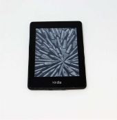 A pre-owned Amazon Kindle Paperwhite (EY21) E-reader in Black (some cosmetic wear).