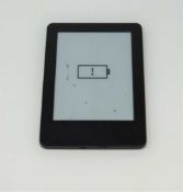 A pre-owned Amazon Kindle Paperwhite (WP63GW) E-reader in Black (heavy cosmetic wear to case, some