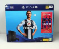 A pre-owned boxed PS4 Pro 1TB in Jet Black with charger, HDMI cable and one controller (Model: CUH-