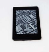 A pre-owned Amazon Kindle Paperwhite (DP75SDI) E-reader in Black (some cosmetic wear).