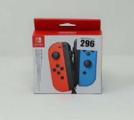 A boxed as new Nintendo Switch Joy-Con Controller Pair in Neon Red/Neon Blue.