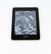 A pre-owned Amazon Kindle Paperwhite (PQ94WIF) E-Reader in Black.