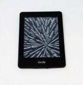 A pre-owned Amazon Kindle Paperwhite (EY21) E-reader in Black.