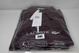 Two as new Lacoste regular fit polo shirts in Bordeaux (2 x US L).
