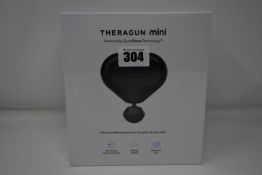 One Theragun Mini ultra portable massage gun.