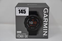 One boxed as new Garmin F?nix 6X Pro Solar GPS, 51mm, multisport watch in black.