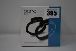 A pair of boxed as new Bond Touch smart bracelets (Bond002).