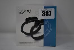 A pair of boxed as new Bond Touch smart bracelets (Bond002).