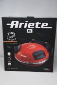 One boxed Ariete Electric Pizza Oven in red (Model: 909).
