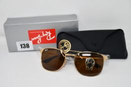 A pair of as new Ray Ban sunglasses.