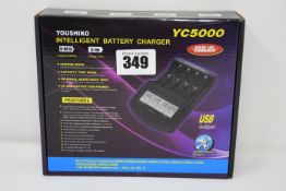 Five boxed as new Youshiko intelligent battery chargers (YC5000).