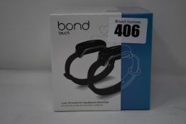 A pair of boxed as new Bond Touch smart bracelets (Bond002).