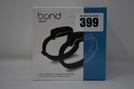 A pair of boxed as new Bond Touch smart bracelets (Bond002).