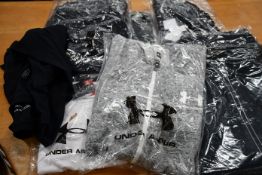 Seven items of as new Under Armour clothing and accessories to include Storm jacket (XXL), men's