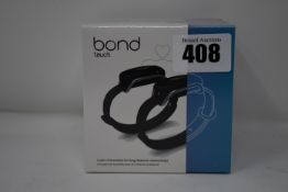 A pair of boxed as new Bond Touch smart bracelets (Bond002).
