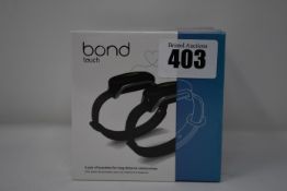 A pair of boxed as new Bond Touch smart bracelets (Bond002).