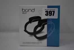 A pair of boxed as new Bond Touch smart bracelets (Bond002).