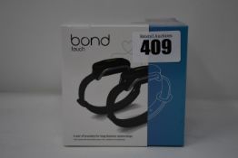 A pair of boxed as new Bond Touch smart bracelets (Bond002).
