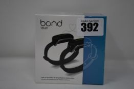 A pair of boxed as new Bond Touch smart bracelets (Bond002).