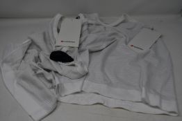 Fifteen as new LuluLemon Swiftly Tech Racerback vests in white (Please note security tags