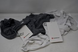 Fifteen as new LuluLemon Swiftly Tech Racerback vests in white and grey (Please note security tags
