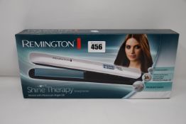 Five boxed as new Remington Shine Therapy Straighteners.