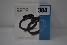 A pair of boxed as new Bond Touch smart bracelets (Bond002).