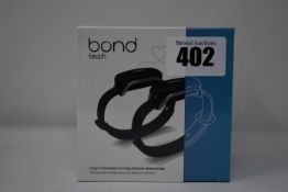 A pair of boxed as new Bond Touch smart bracelets (Bond002).