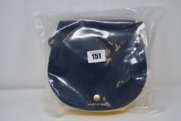 An as new Honey & Toast Etter leather saddlebag handbag in navy and sun yellow (RRP £120).