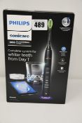 One as new Philips Sonicare Diamondclean smart sonic electric toothbrush.