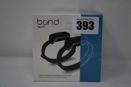 A pair of boxed as new Bond Touch smart bracelets (Bond002).