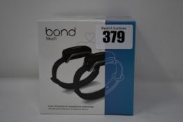 A pair of boxed as new Bond Touch smart bracelets (Bond002).