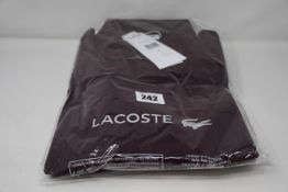 Two as new Lacoste regular fit polo shirts in Bordeaux (1 x US XXl, 1 x XXXL).