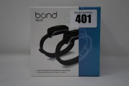 A pair of boxed as new Bond Touch smart bracelets (Bond002).