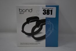 A pair of boxed as new Bond Touch smart bracelets (Bond002).