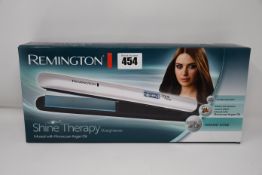 Five boxed as new Remington Shine Therapy Straighteners.