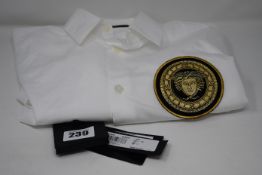 An as new Versace white shirt with logo (Size 39 - RRP £145).