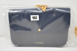An as new Honey & Toast Eddie leather handbag in navy and grey (RRP £135).