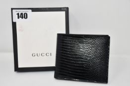 An as new Gucci black leather wallet (Initialled B.G.P. on the inside, complete with box, there