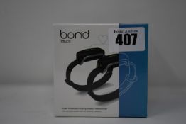 A pair of boxed as new Bond Touch smart bracelets (Bond002).