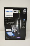 One as new Philips Sonicare Diamondclean smart sonic electric toothbrush.