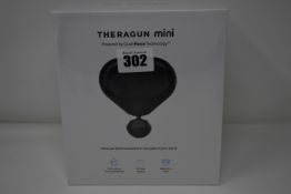 One Theragun Mini ultra portable massage gun.