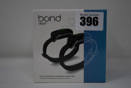 A pair of boxed as new Bond Touch smart bracelets (Bond002).