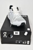 A pair of as new On Running Cloudsurfer trainers (UK 6.5).