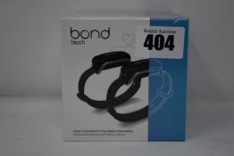 A pair of boxed as new Bond Touch smart bracelets (Bond002).