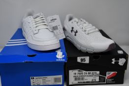 A pair of as new Adidas Supercourt trainers (UK 7) together with a pair of Under Armour Charged