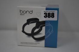 A pair of boxed as new Bond Touch smart bracelets (Bond002).