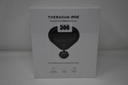 One Theragun Mini ultra portable massage gun.