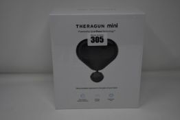 One Theragun Mini ultra portable massage gun.